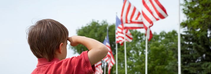 Chiropractic Irving TX Little Boy Saluting Flag
