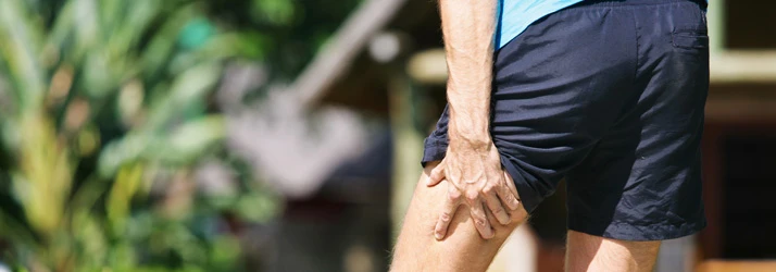 Chiropractic Irving TX Man Outdoors With Sciatica Pain