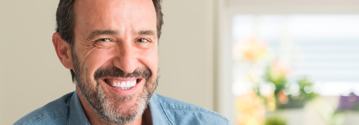 Pain Free Middle Aged Smiling Man